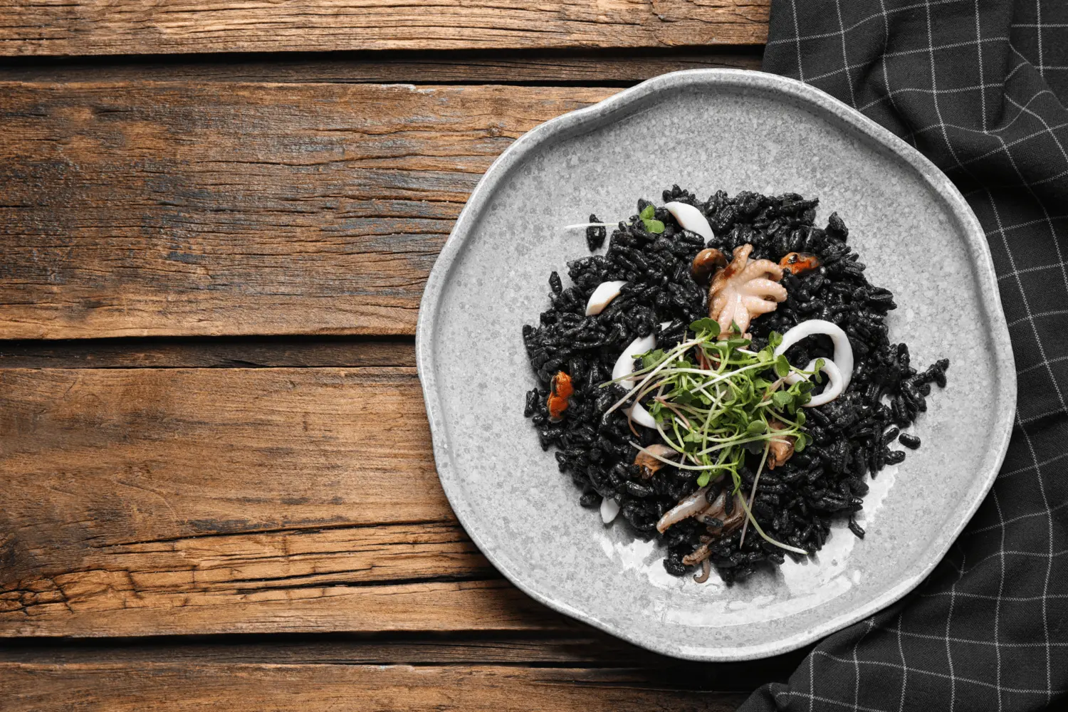 Black risotto served on a plate