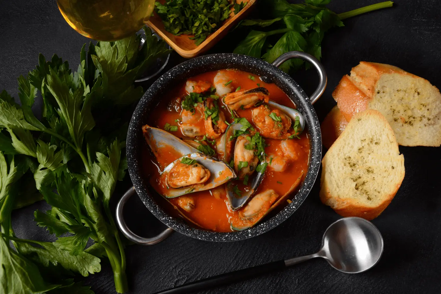 Brodet-Tangy Tomato Broth in pot with bread