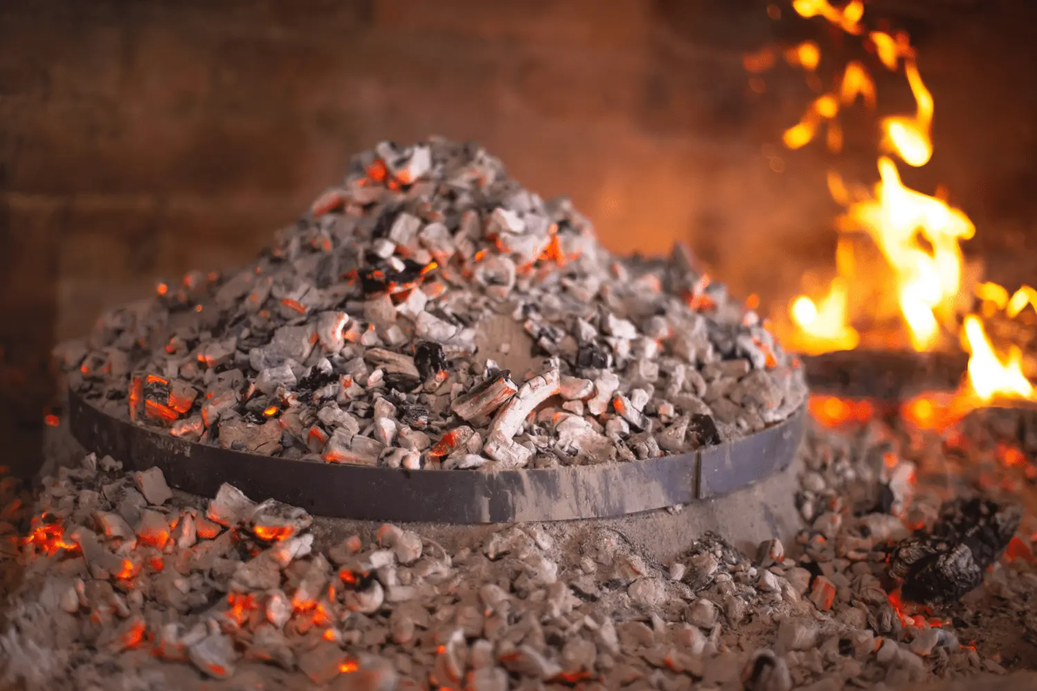 Peka covered with fire stones on the fire place.