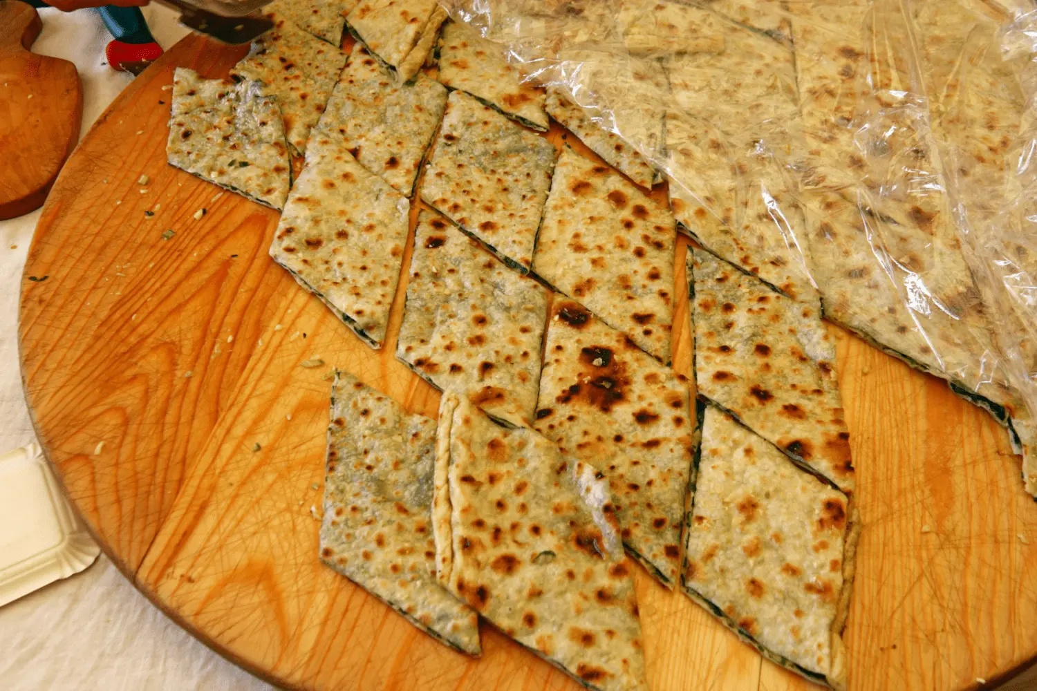 Soparnik- tradional Croatian dish served on a wodden wheel